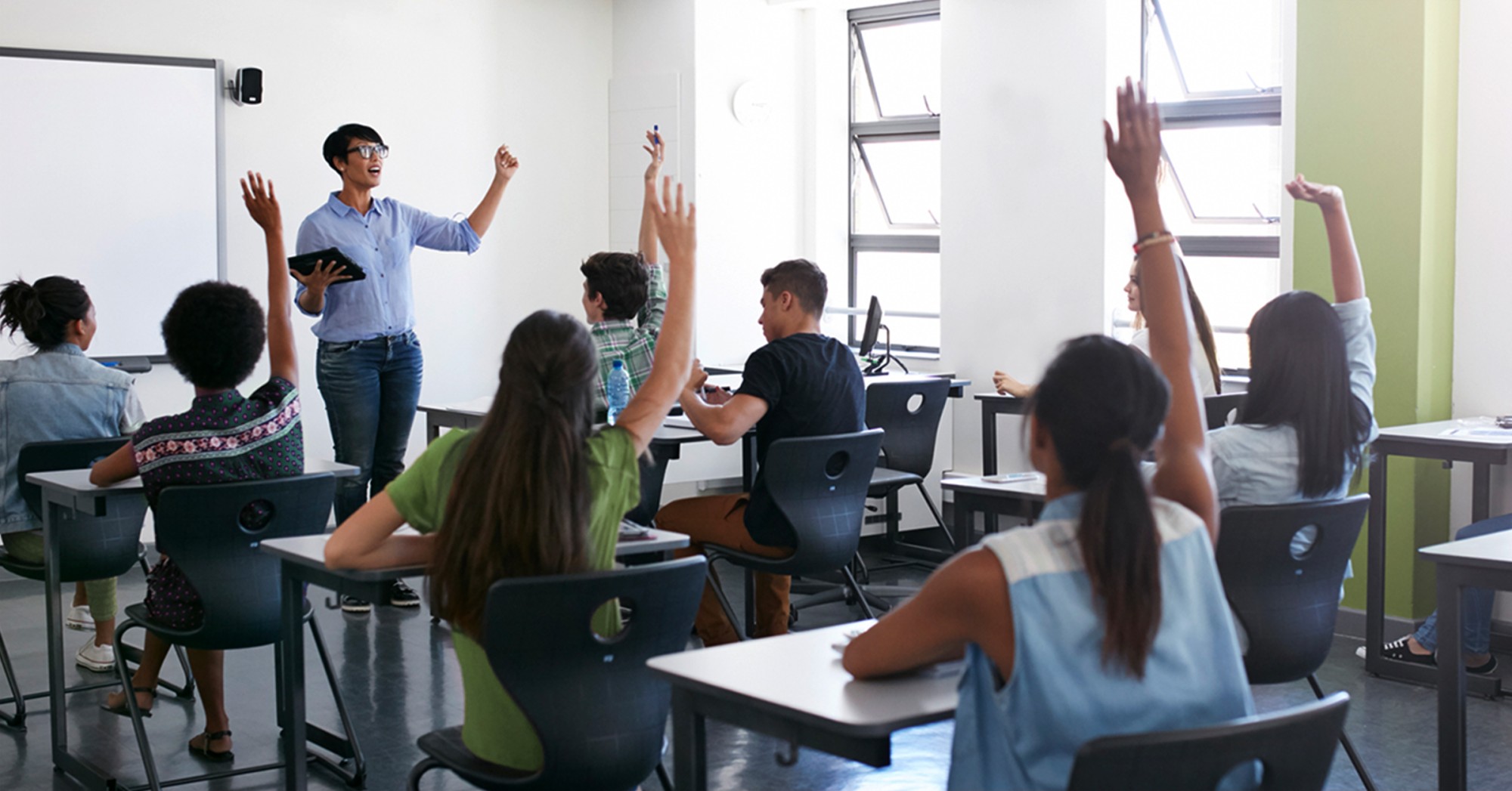 teacher and students participating in a classroom lecture