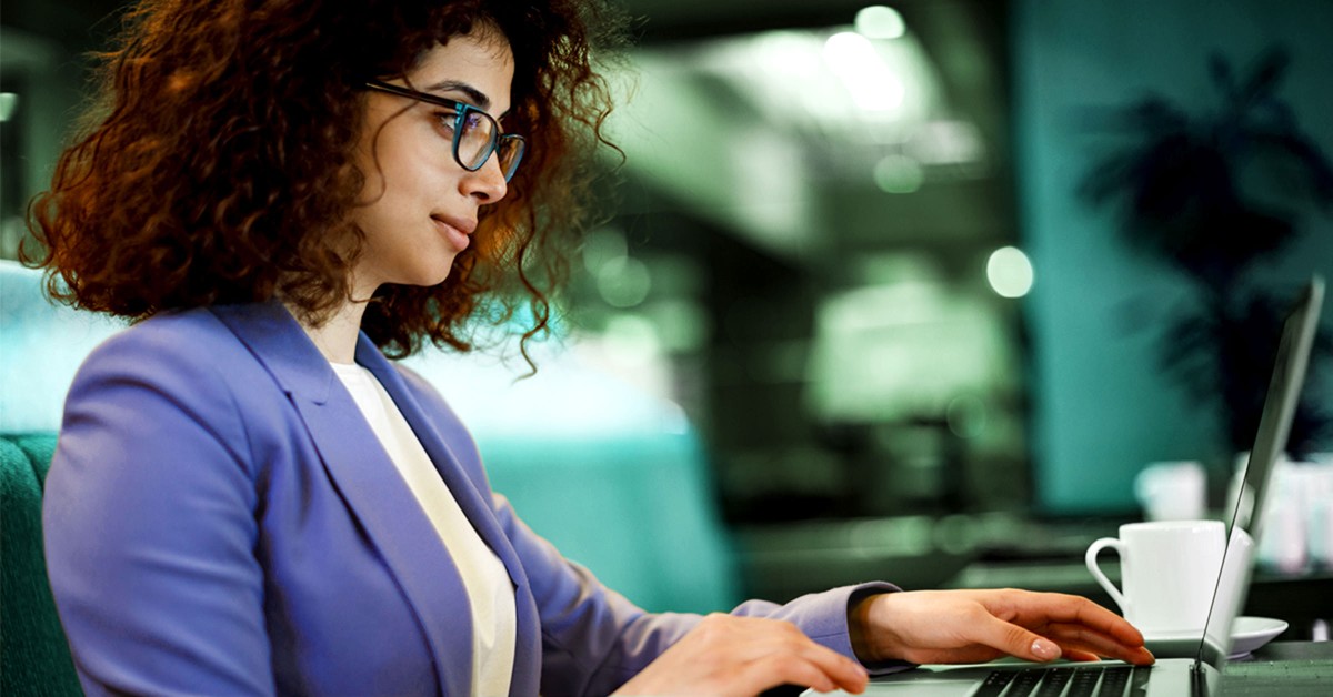 Photo of a woman working at a laptop