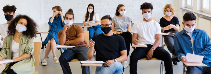 A group of students wearing face masks inside a classroom