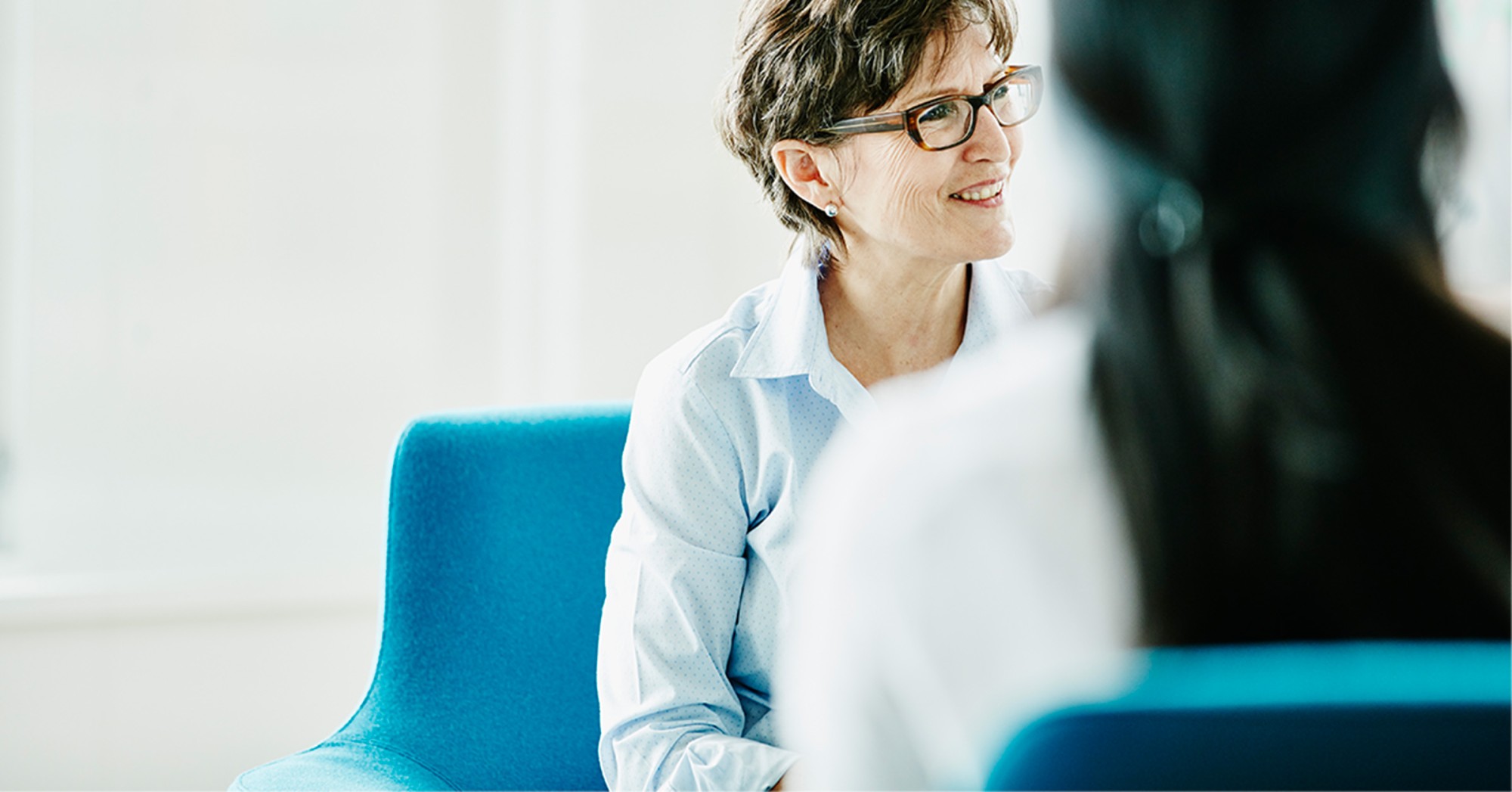 Photo of two people talking