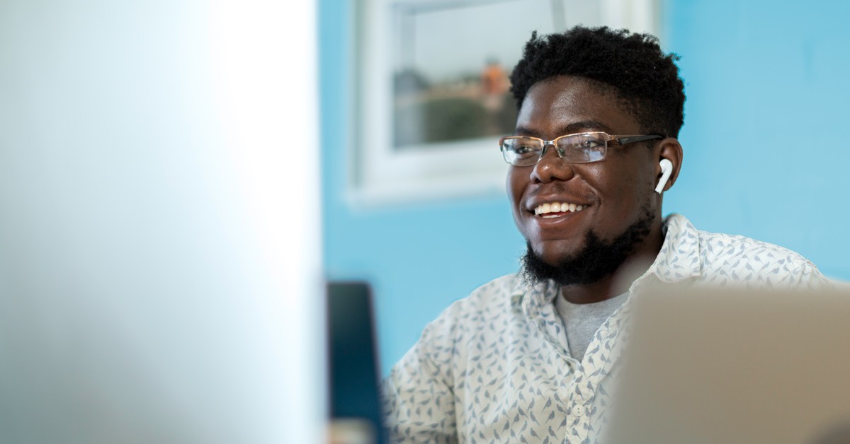 Photo of a person working at a computer