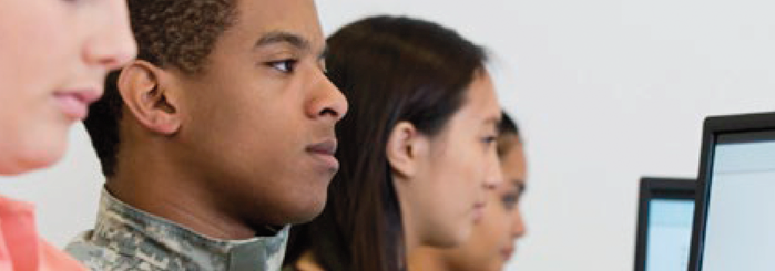 Government employees at desktop computers taking online training courses